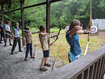 Learning archery at camp